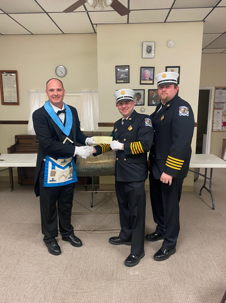 James presents check to Waymart FD